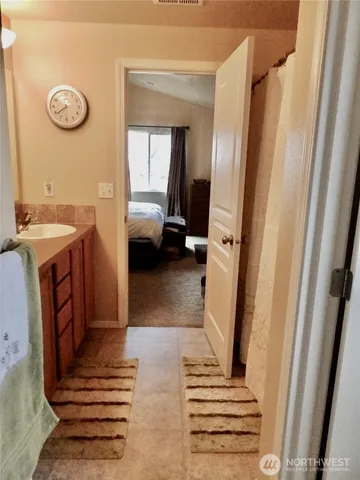 a view of a hallway with washer and dryer