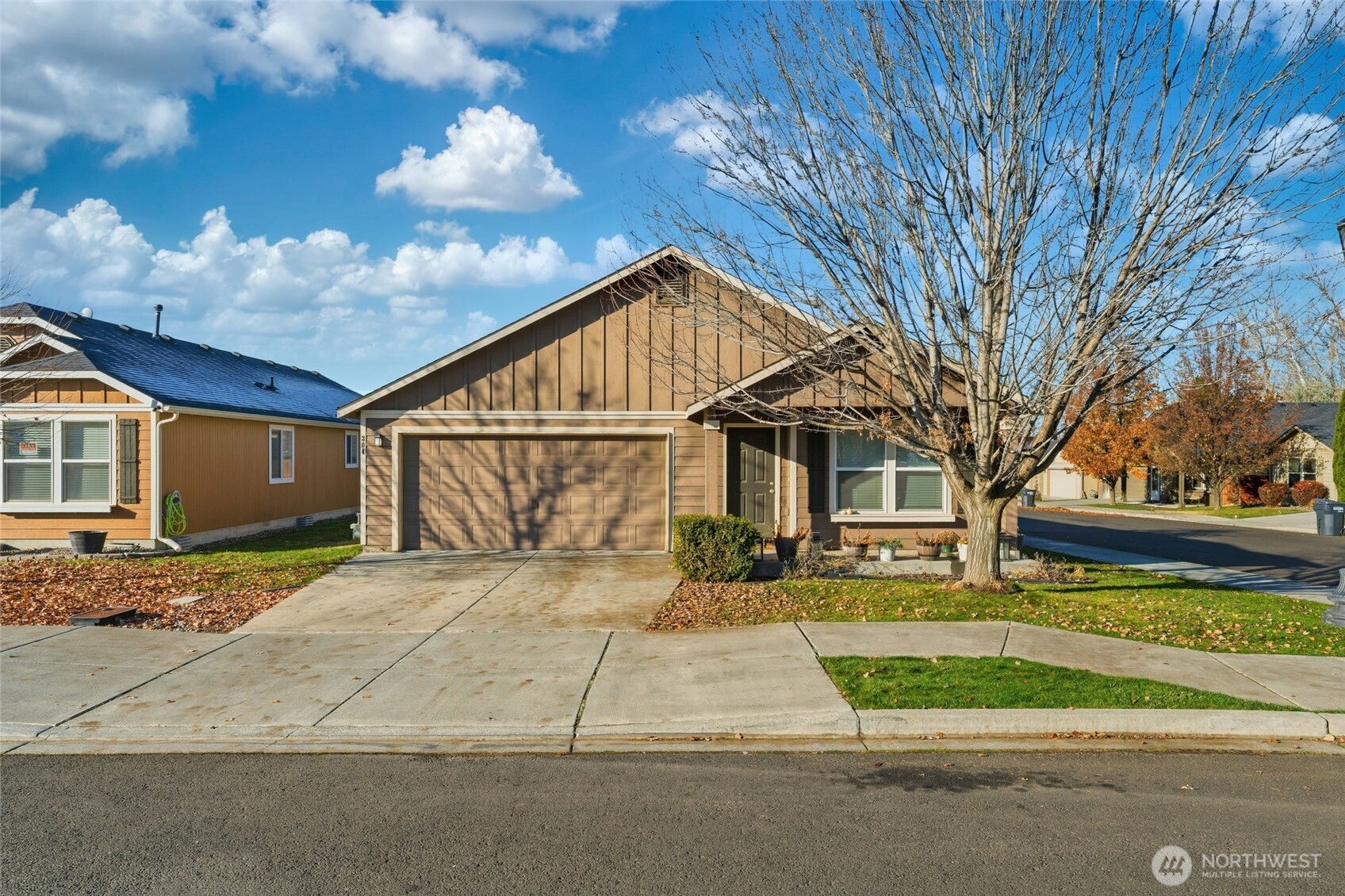 304 Southwest Homestead Avenue College Place, WA 99324 - Photo 2 of 21 a view of a house with a yard