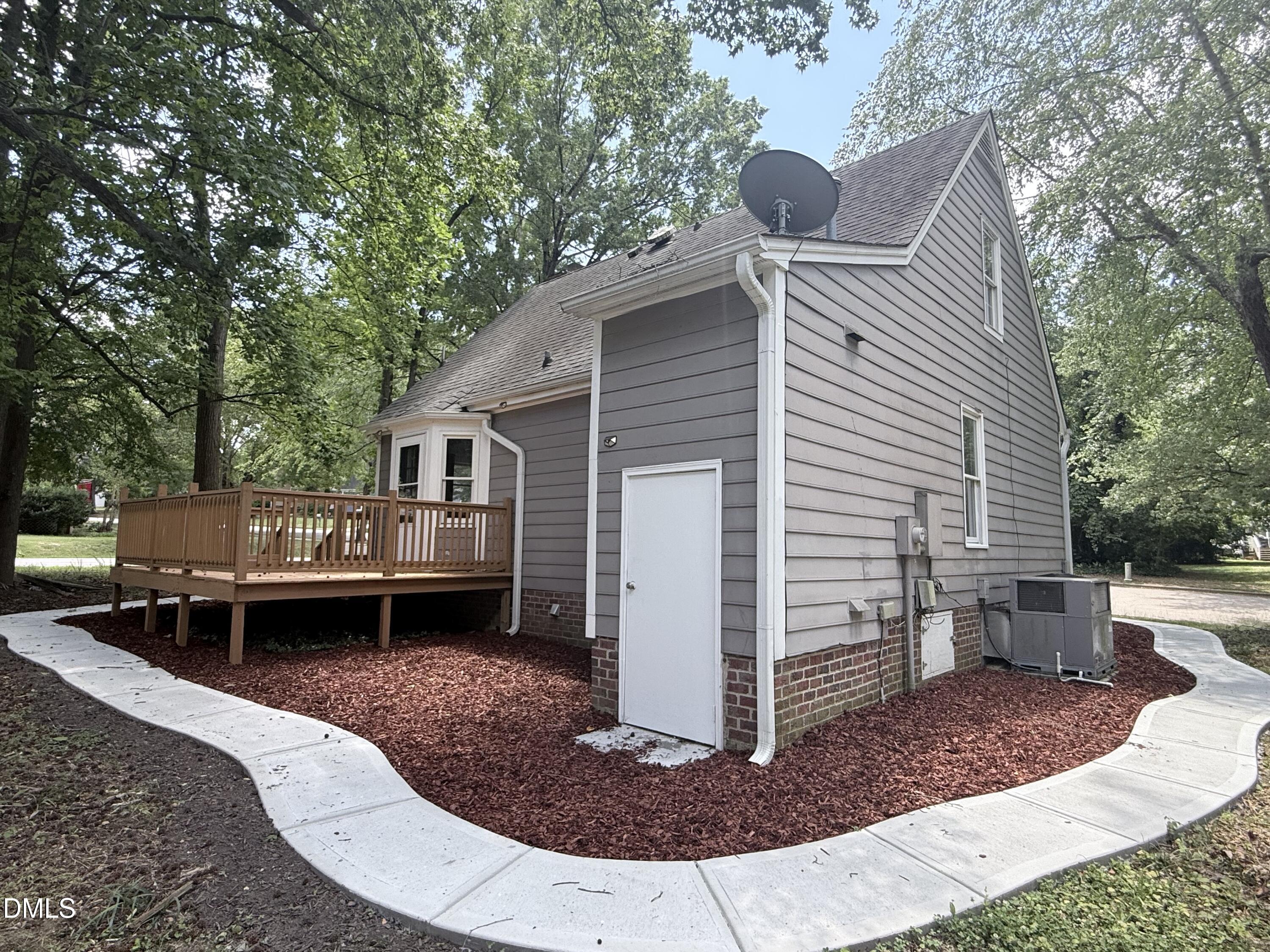 2900 Broadlands Drive Raleigh, NC 27604 - Photo 9 of 60 a view of house with a chairs and table in the patio