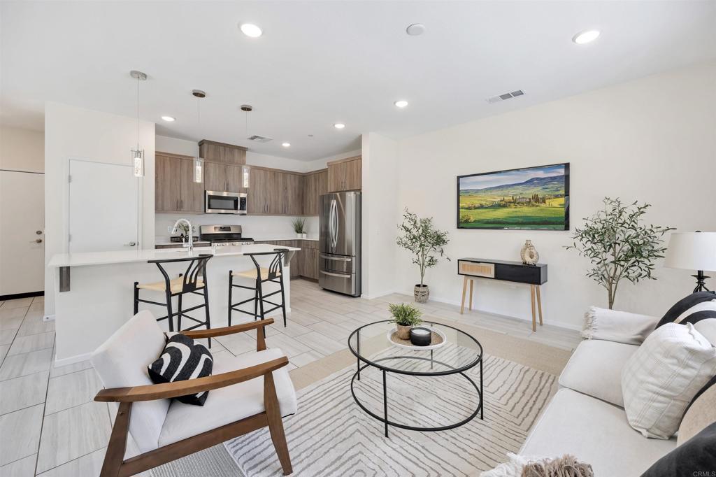 35103 Vine Place Fallbrook, CA 92028 - Photo 21 of 42 a living room with furniture and kitchen view