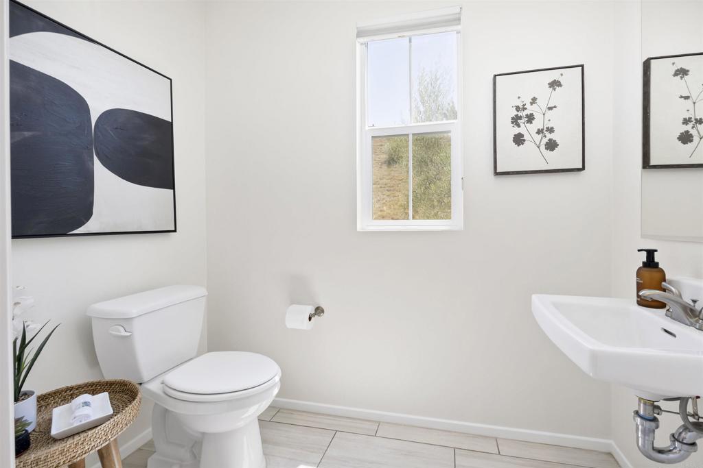 35103 Vine Place Fallbrook, CA 92028 - Photo 25 of 42 a bathroom with a toilet sink and mirror