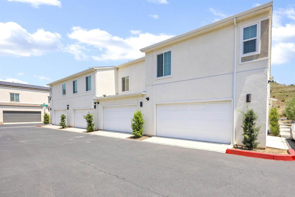35103 Vine Place Fallbrook, CA 92028 - Photo 36 of 42 a front view of a house with a yard and garage