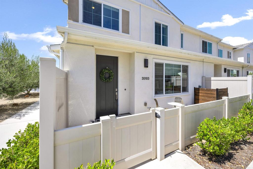 35103 Vine Place Fallbrook, CA 92028 - Photo 4 of 42 a front view of a house with plants