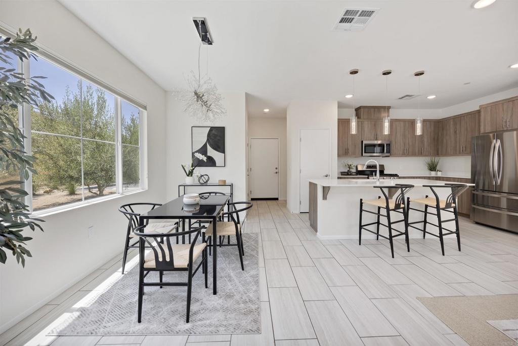 35103 Vine Place Fallbrook, CA 92028 - Photo 8 of 42 a view of a dining room with furniture window and outside view