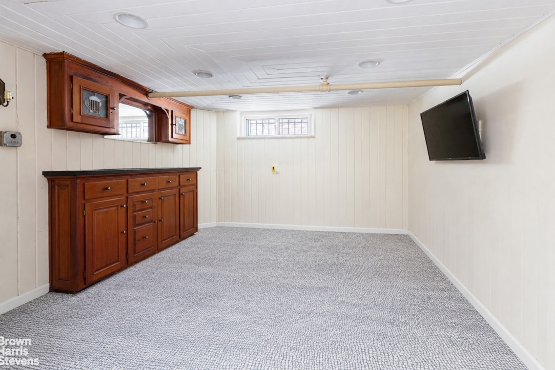 1917 Glenwood Road Brooklyn, NY 11230 - Photo 14 of 22 a view of a livingroom with a flat screen tv