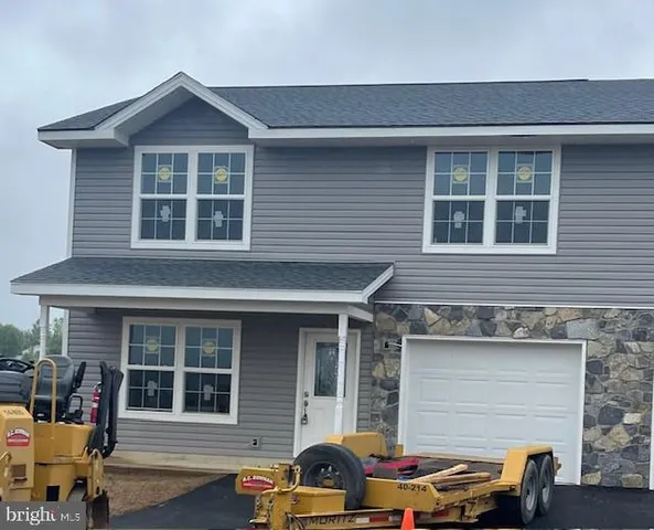 a front view of a house with outdoor space