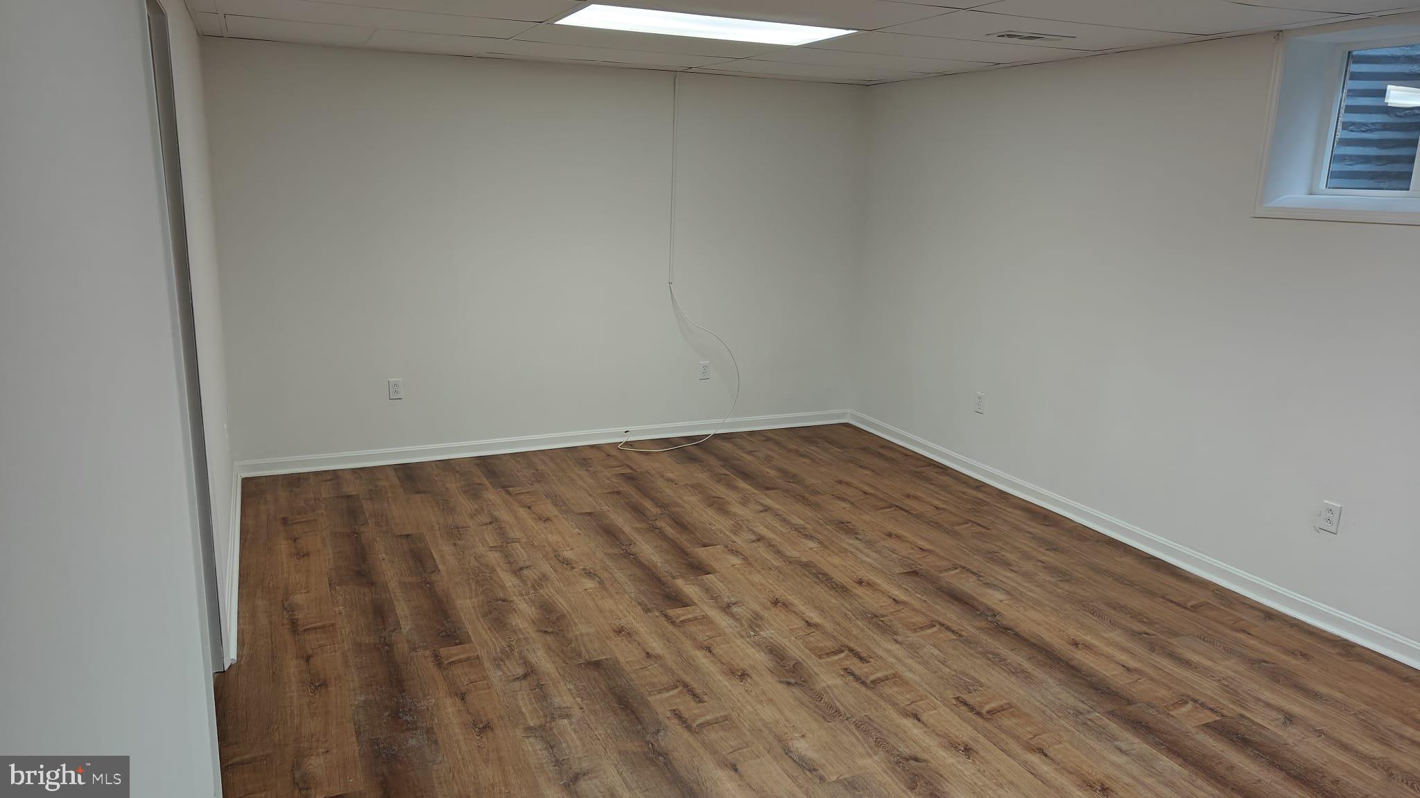 9776 Whiskey Run Laurel, MD 20723 - Photo 20 of 23 a view of wooden floor in an empty room