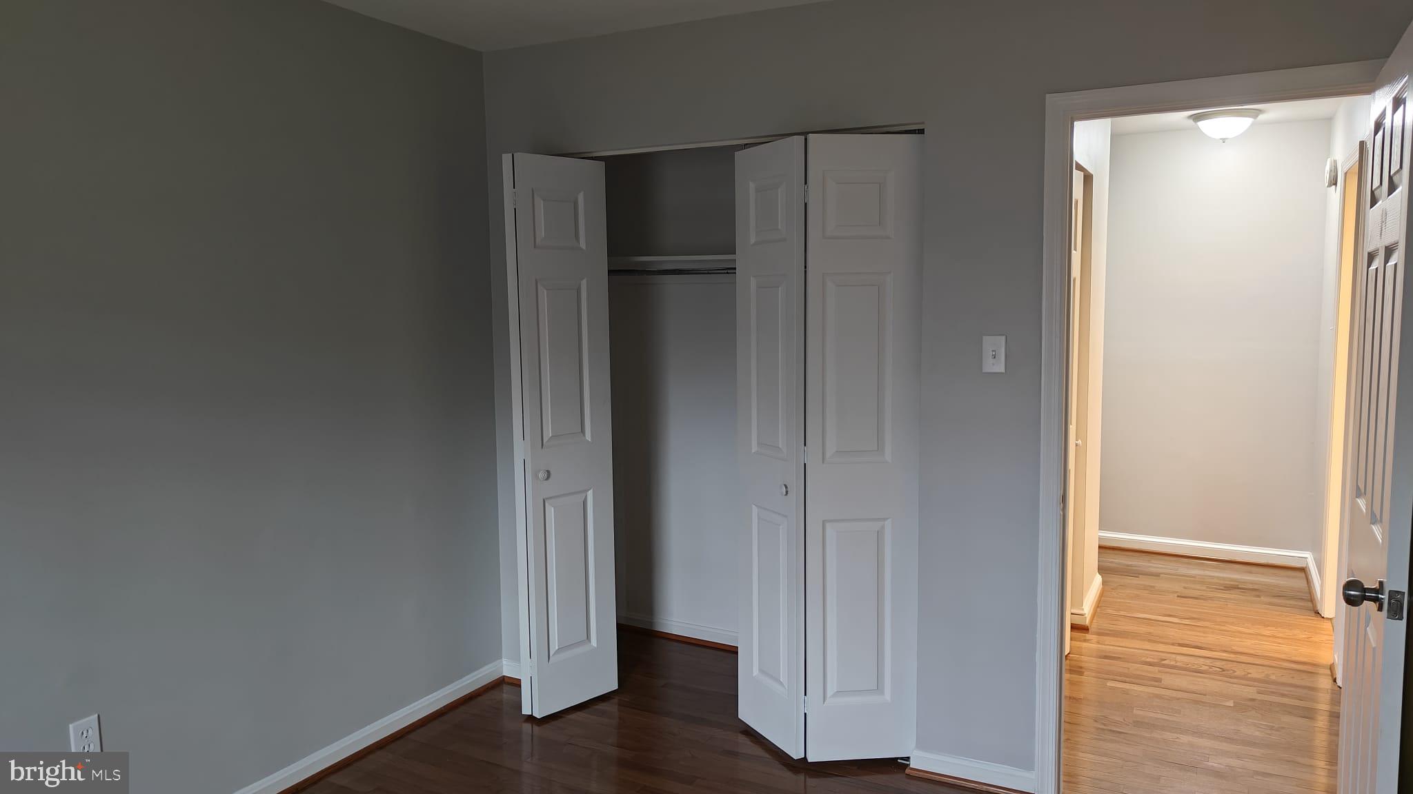 9776 Whiskey Run Laurel, MD 20723 - Photo 5 of 23 a view of walk in closet with wooden floor