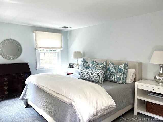 200 West Norwalk Road Norwalk, CT 06850 - Photo 7 of 9 a bedroom with a bed and window