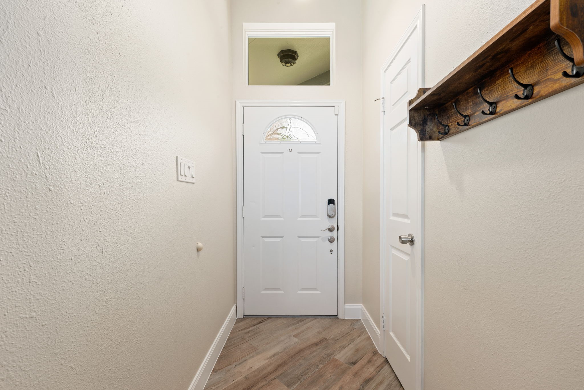 1915 Mercoal Drive Spring, TX 77386 - Photo 7 of 50 Bright entryway with high ceilings and a welcoming foyer leading into the main living areas.