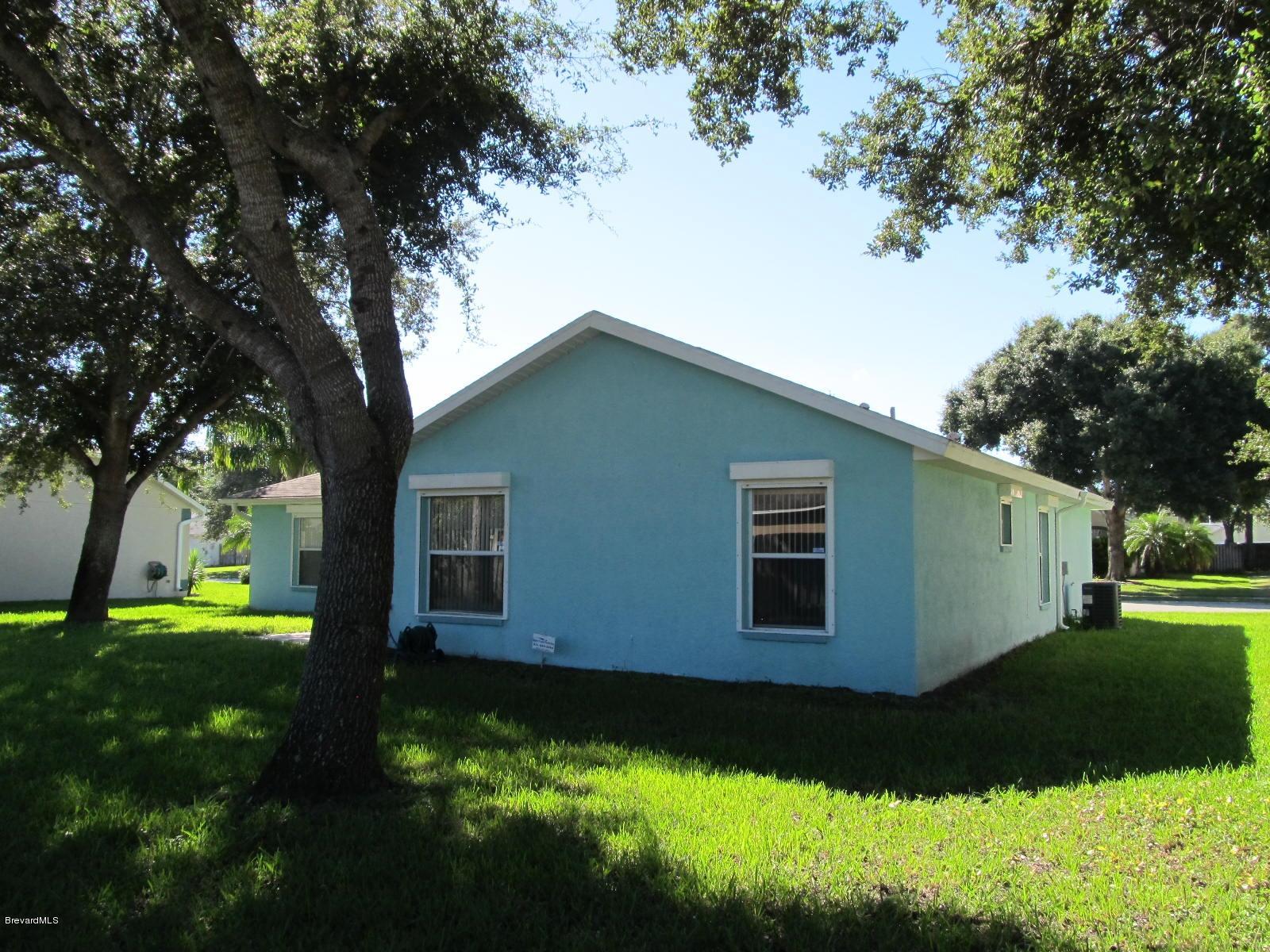 198 Twin Lakes Road Melbourne, FL 32901 - Photo 24 of 26 Backyard NW Corner of Home