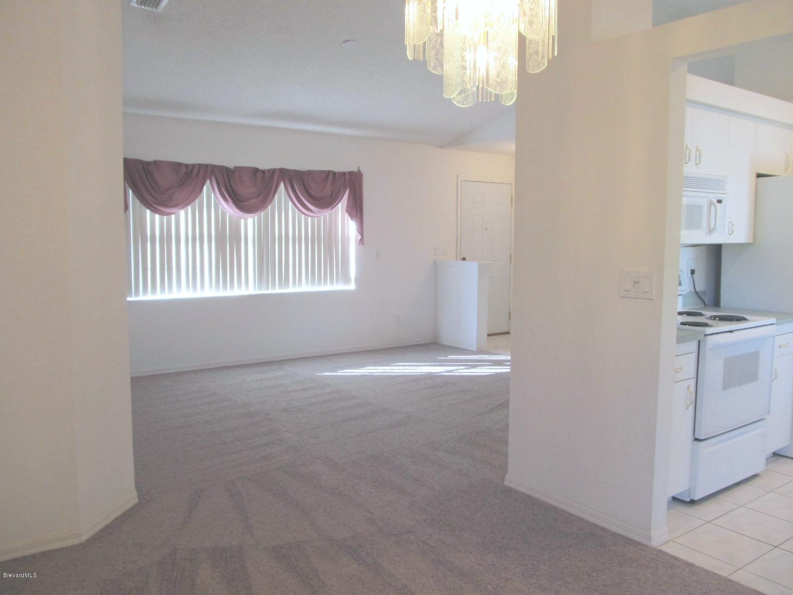 198 Twin Lakes Road Melbourne, FL 32901 - Photo 7 of 26 Dining to Living Room View