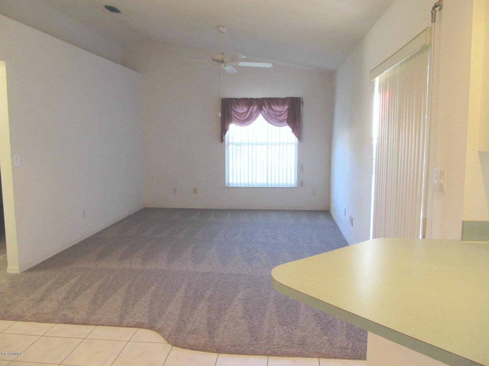 198 Twin Lakes Road Melbourne, FL 32901 - Photo 10 of 26 Family Room View from Kitchen