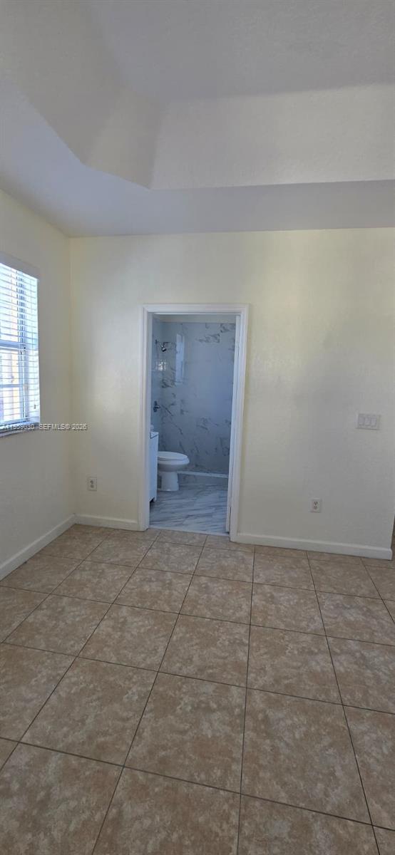 1480 Northeast 33rd Avenue, Unit 210 Homestead, FL 33033 - Photo 5 of 12 a view of an empty room and window