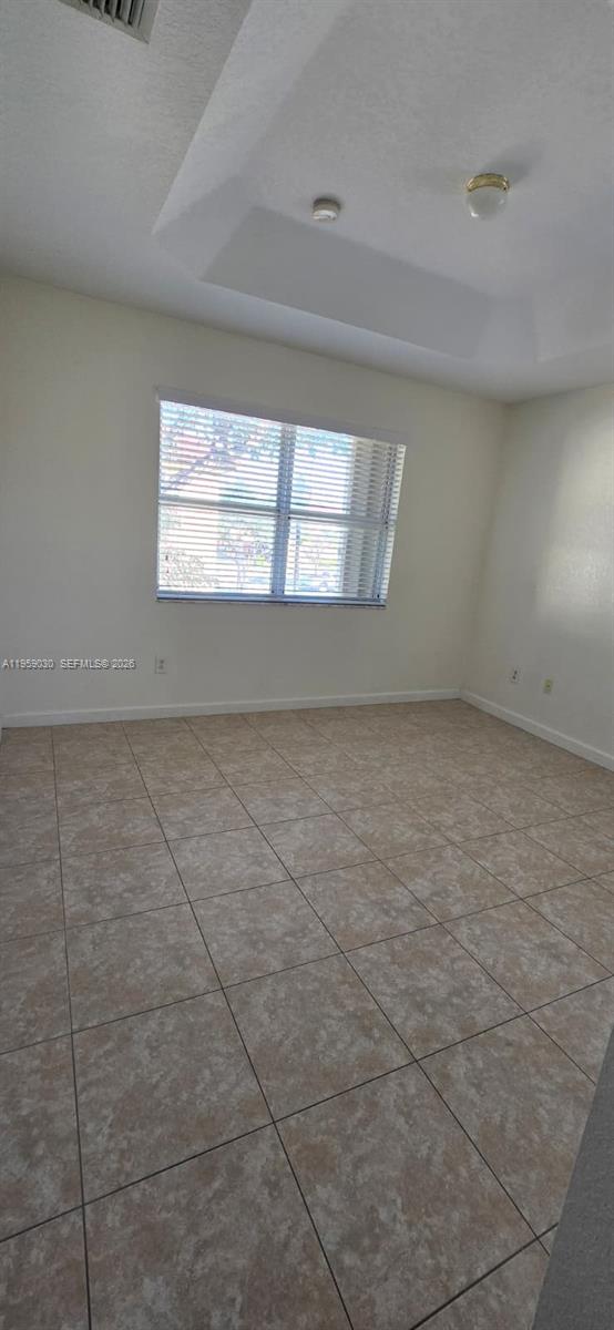 1480 Northeast 33rd Avenue, Unit 210 Homestead, FL 33033 - Photo 6 of 12 en empty room with windows