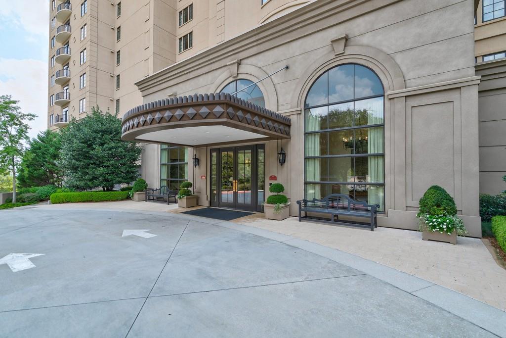 a front view of a building with sitting area