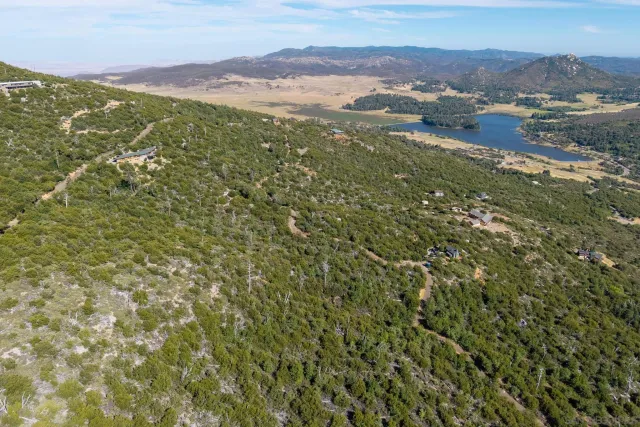 a view of a large building with a mountain in the background