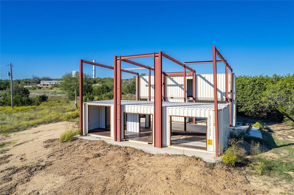 237 County Road 2565 Walnut Springs, TX 76690 - Photo 2 of 11 a house view with a backyard space