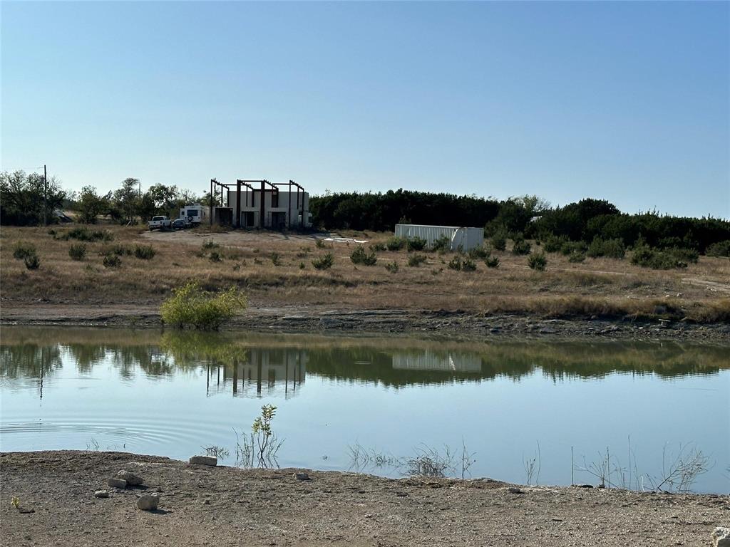 237 County Road 2565 Walnut Springs, TX 76690 - Photo 7 of 11 a view of a lake with a big yard