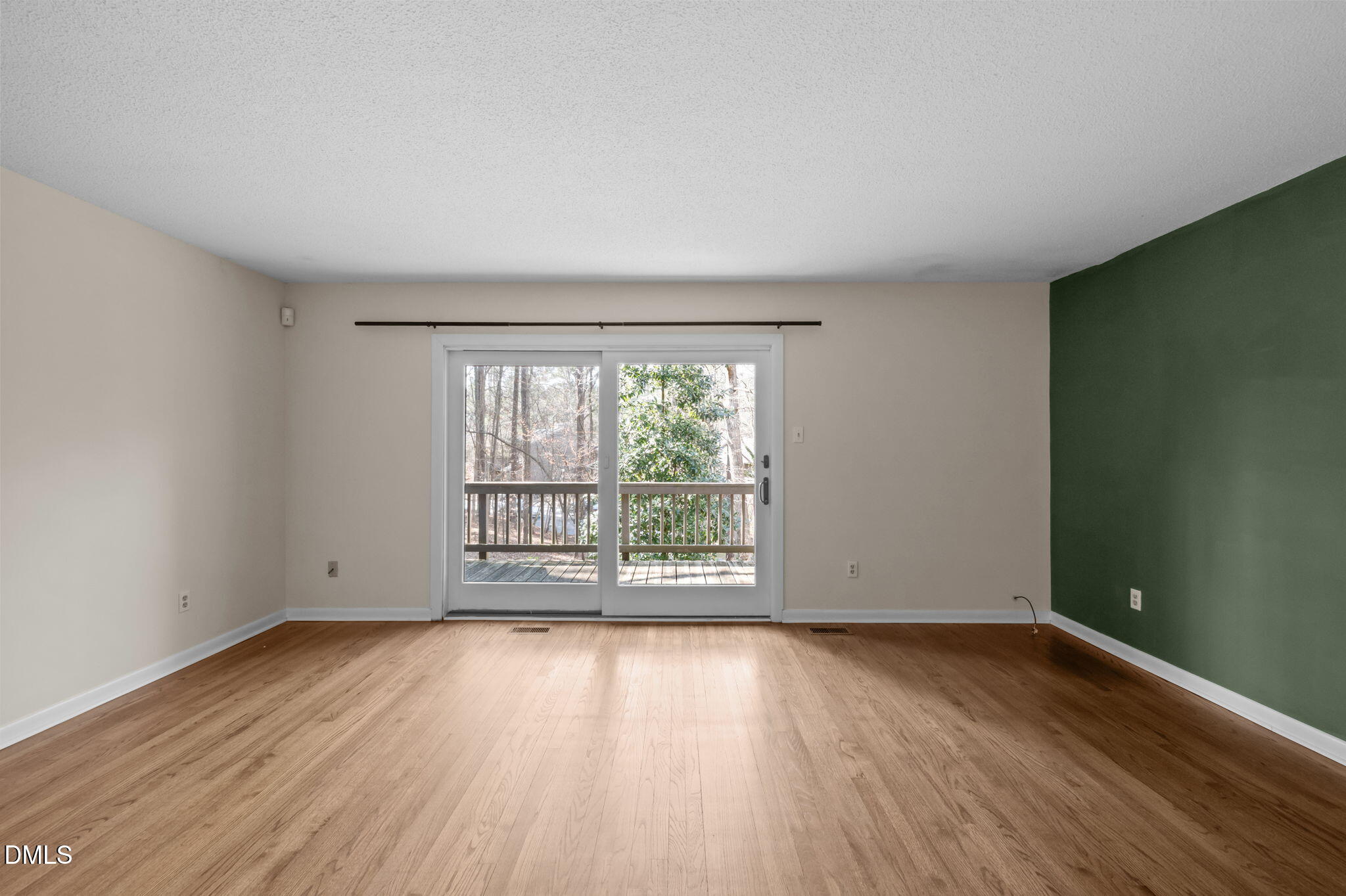 206 Ridge Trail Chapel Hill, NC 27516 - Photo 11 of 32 an empty room with wooden floor and windows