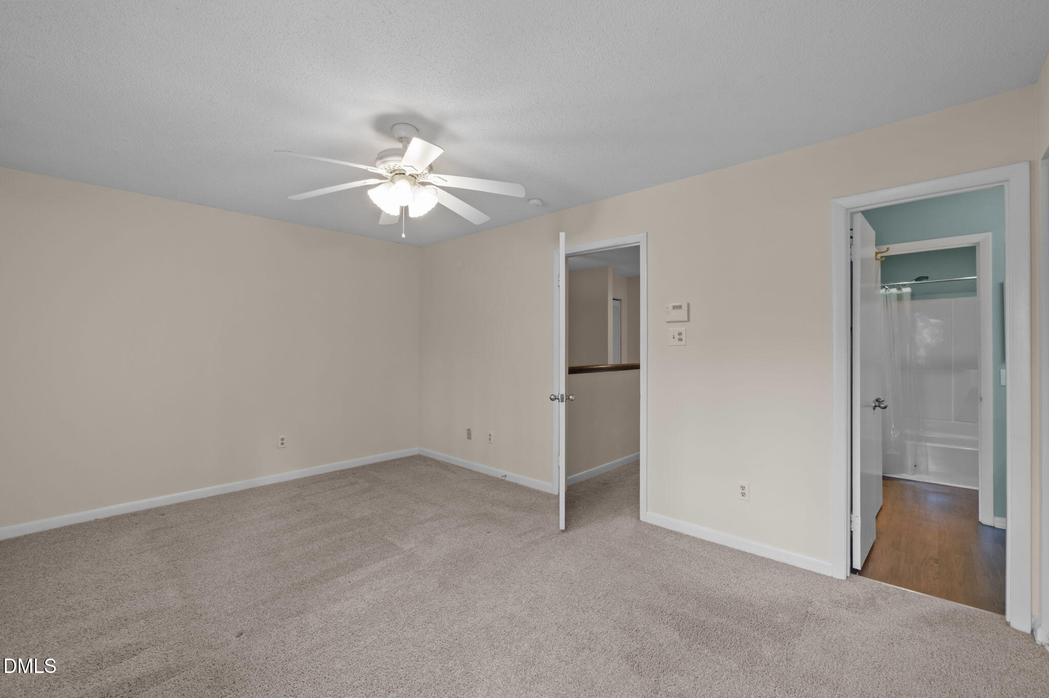 206 Ridge Trail Chapel Hill, NC 27516 - Photo 17 of 32 a view of a room with a ceiling fan and a fan