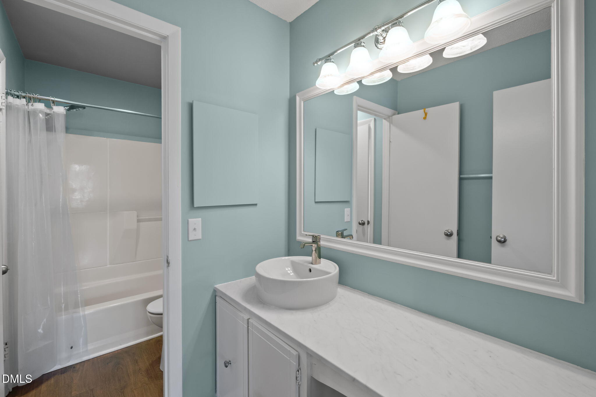 206 Ridge Trail Chapel Hill, NC 27516 - Photo 18 of 32 a bathroom with a sink a light fixture and a mirror