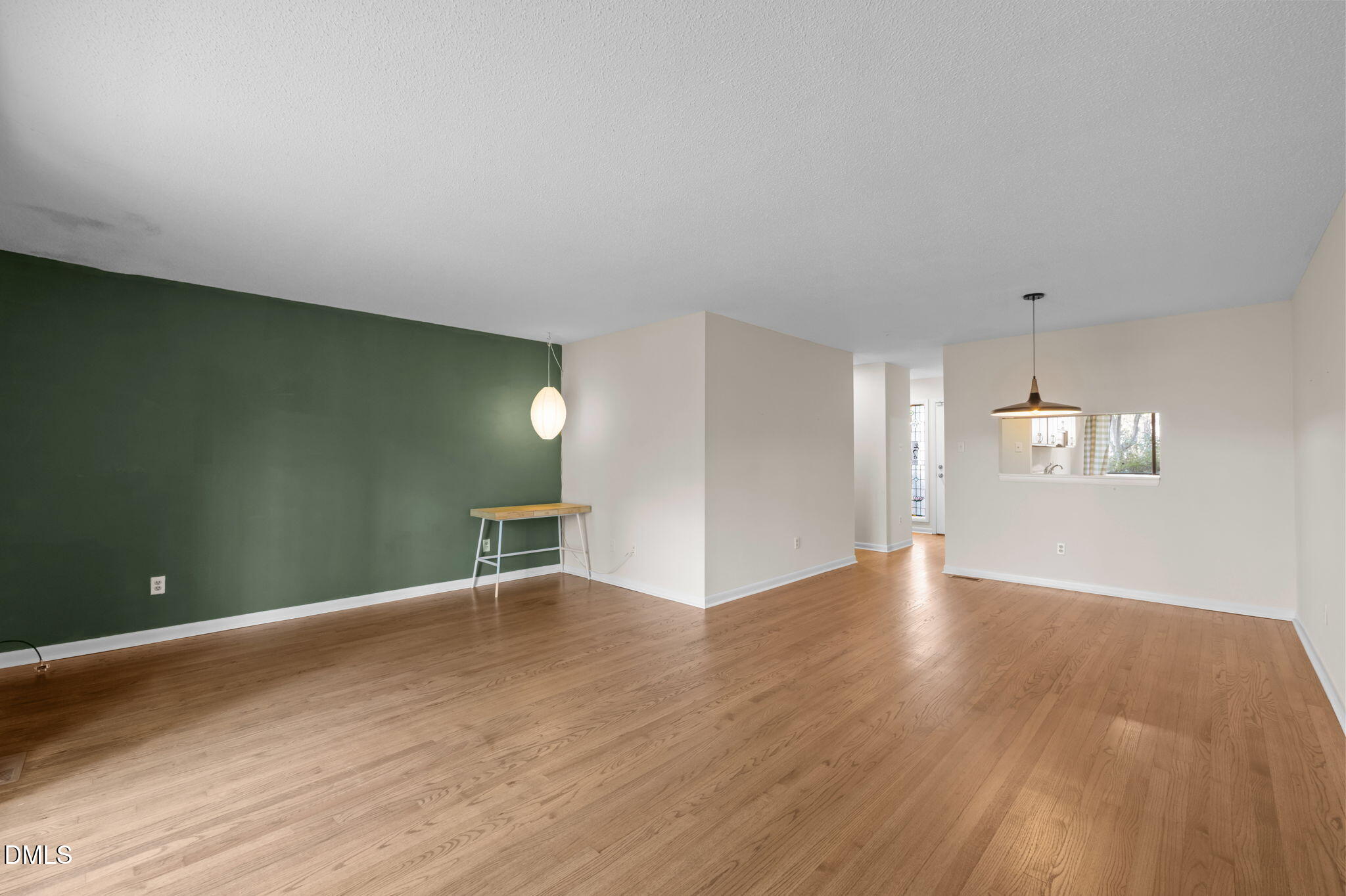 206 Ridge Trail Chapel Hill, NC 27516 - Photo 10 of 32 a view of an empty room with window and wooden floor
