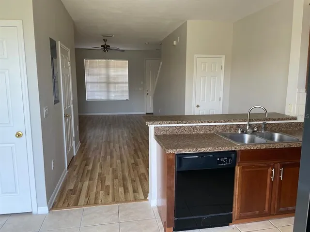 a view of a kitchen from the hallway