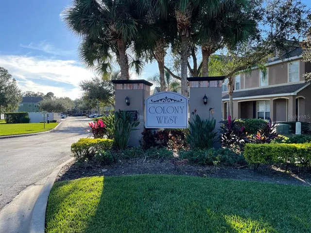 a view of a house with a backyard and a garden