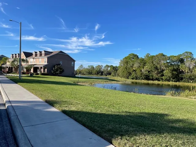 a view of a lake with a yard