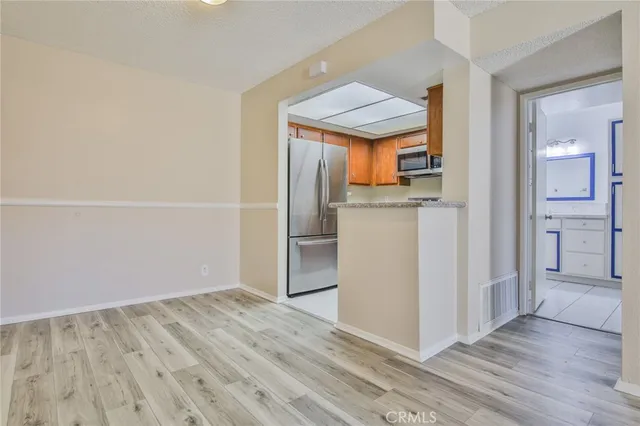 a view of a kitchen from the hallway