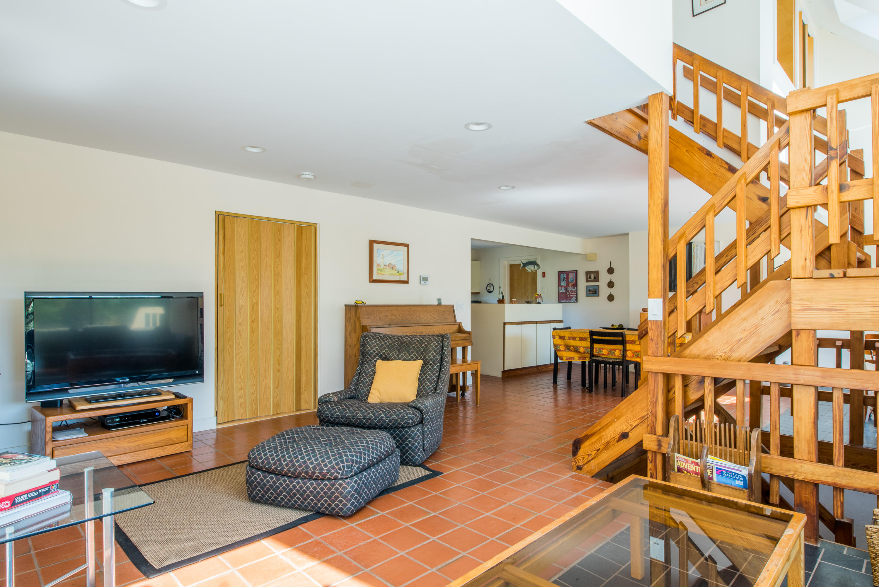 11 Pilgrim Pond Road Truro, MA 02666 - Photo 18 of 35 a living room with furniture and a flat screen tv