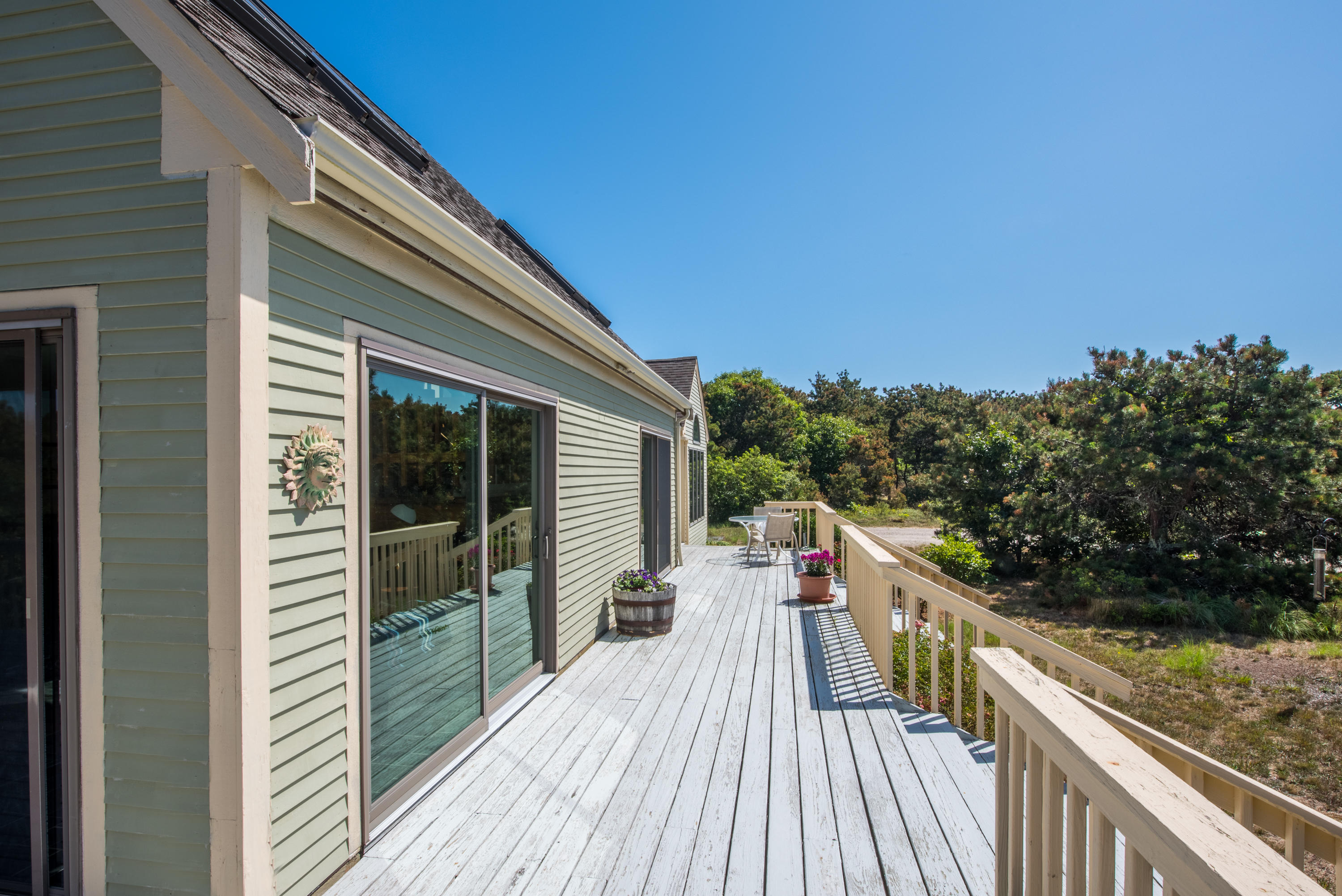 11 Pilgrim Pond Road Truro, MA 02666 - Photo 3 of 35 a view of a balcony with wooden floor