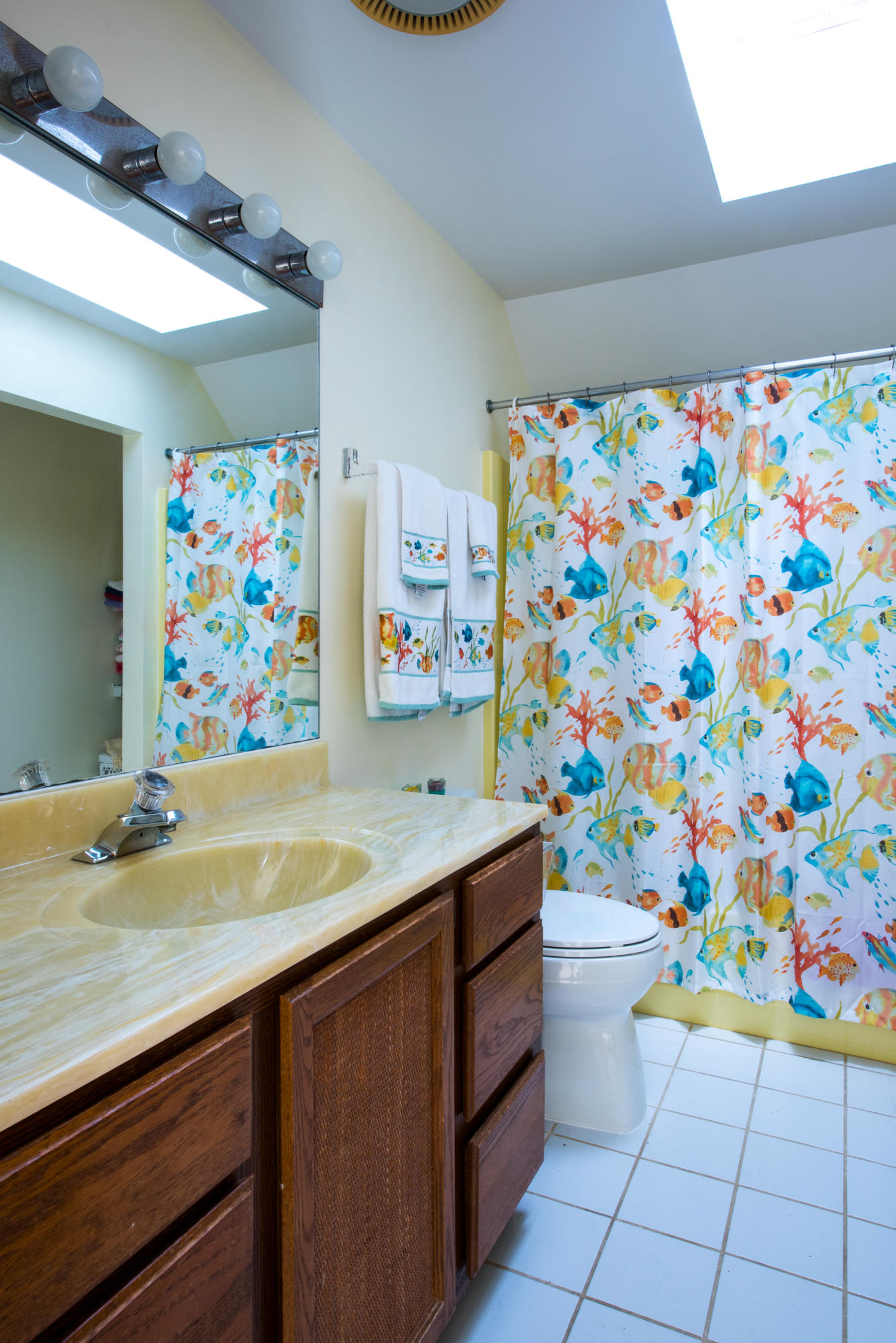 11 Pilgrim Pond Road Truro, MA 02666 - Photo 33 of 35 a bathroom with a sink a vanity and a shower curtain
