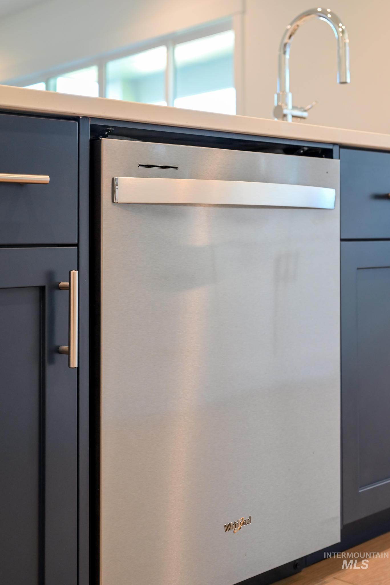 9074 West Moonglade Street Star, ID 83669 - Photo 14 of 40 Integrated stainless steel dishwasher featuring a bar handle