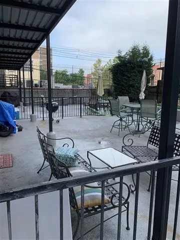 a view of a dinning table and chairs in patio