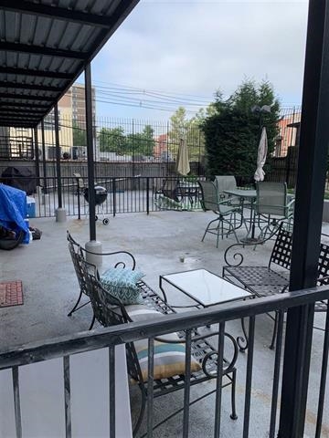 204 Grand Street, Unit 2C Hoboken, NJ 07030 - Photo 3 of 14 a view of a dinning table and chairs in patio