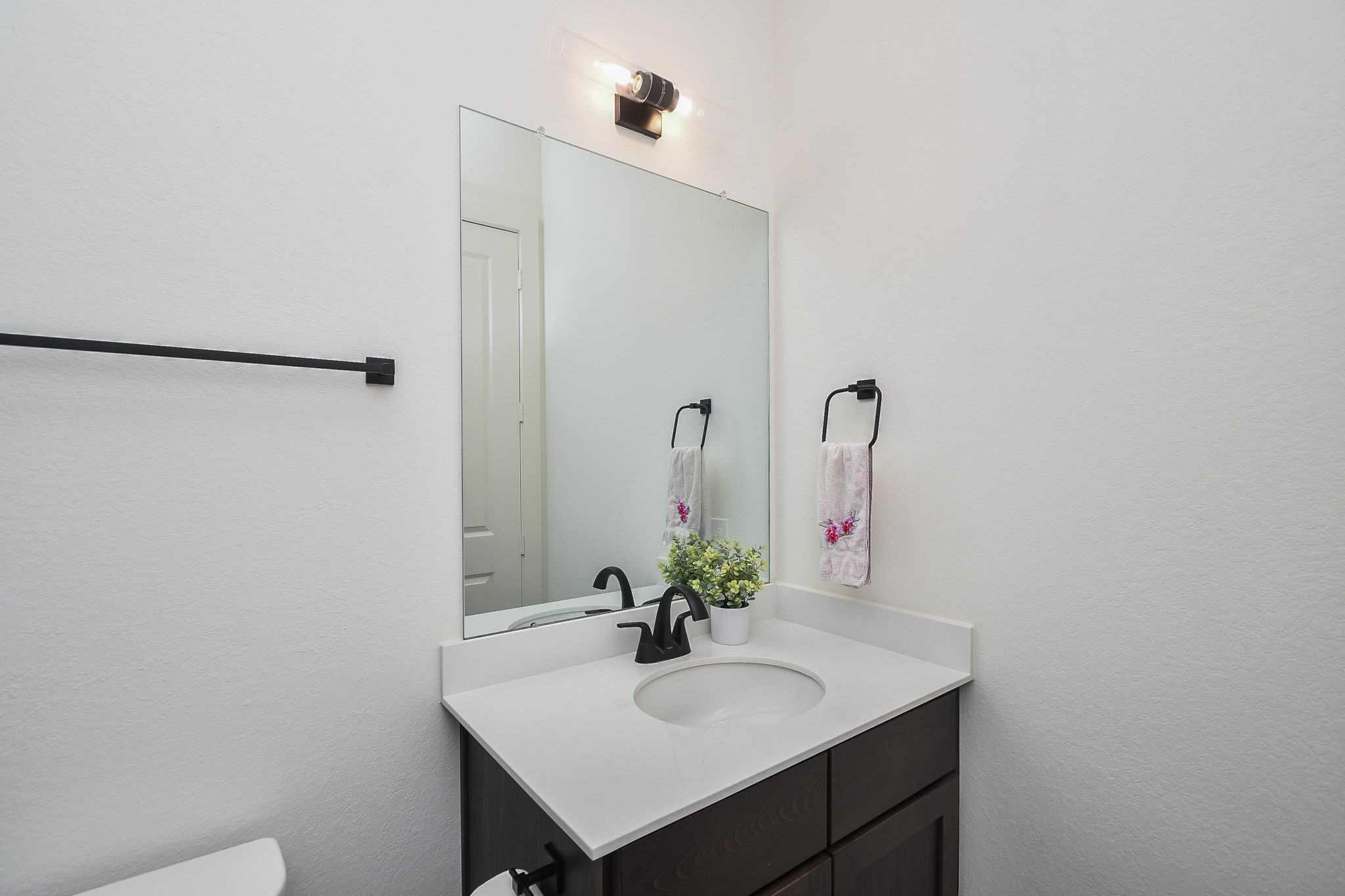 31915 Sky Rdg Lane Fulshear, TX 77441 - Photo 37 of 38 Discover elegance in secondary bathroom, featuring sleek gray tiles, a modern glass shower, and chic black fixtures for a contemporary touch.