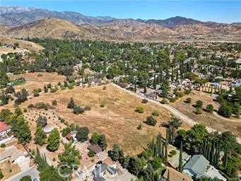 a view of a yard with a mountain
