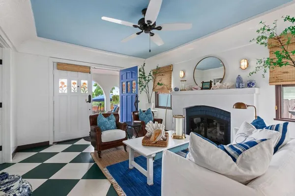 a living room with furniture and a fireplace