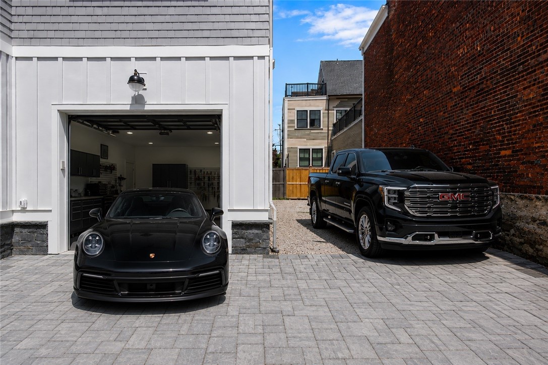 6 Sharon Court Newport, RI 02840 - Photo 46 of 49 9x9 garage door opening with side parking for 3 cars. Digitally staged