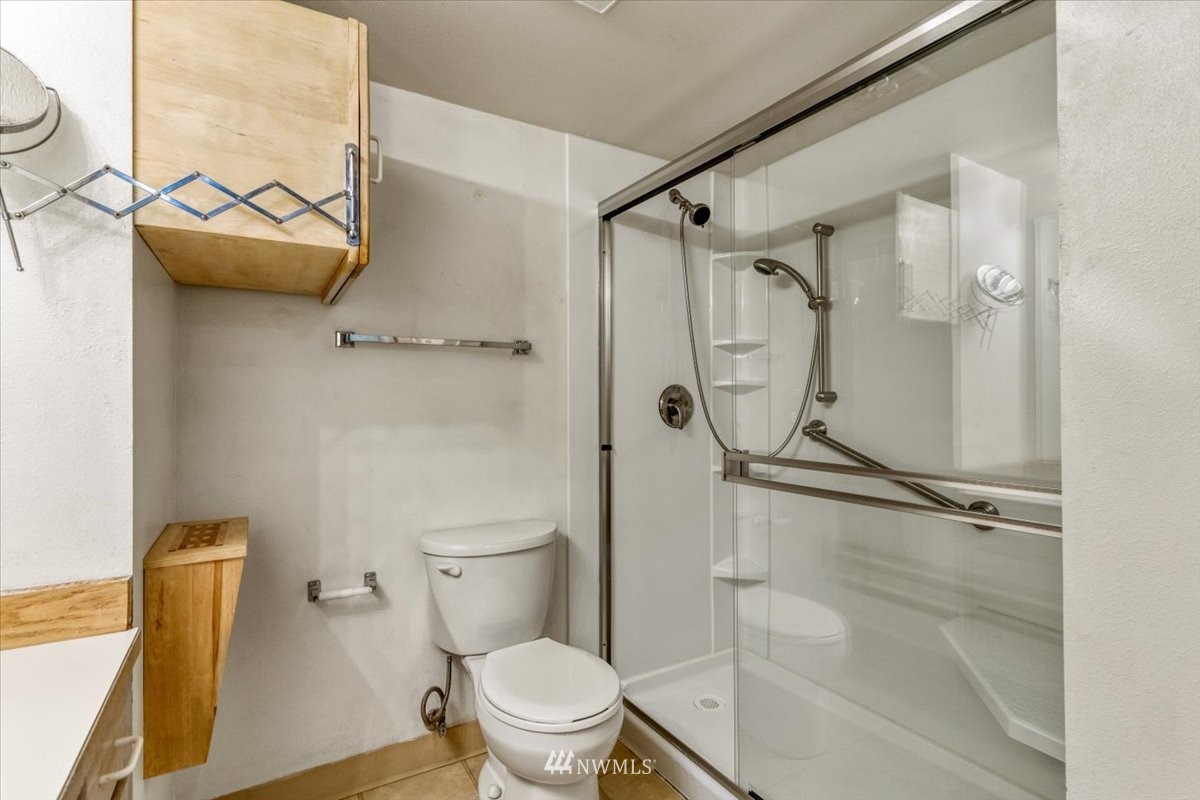 506 East Howell Street, Unit 108 Seattle, WA 98122 - Photo 14 of 20 a white toilet sitting next to a bathroom sink