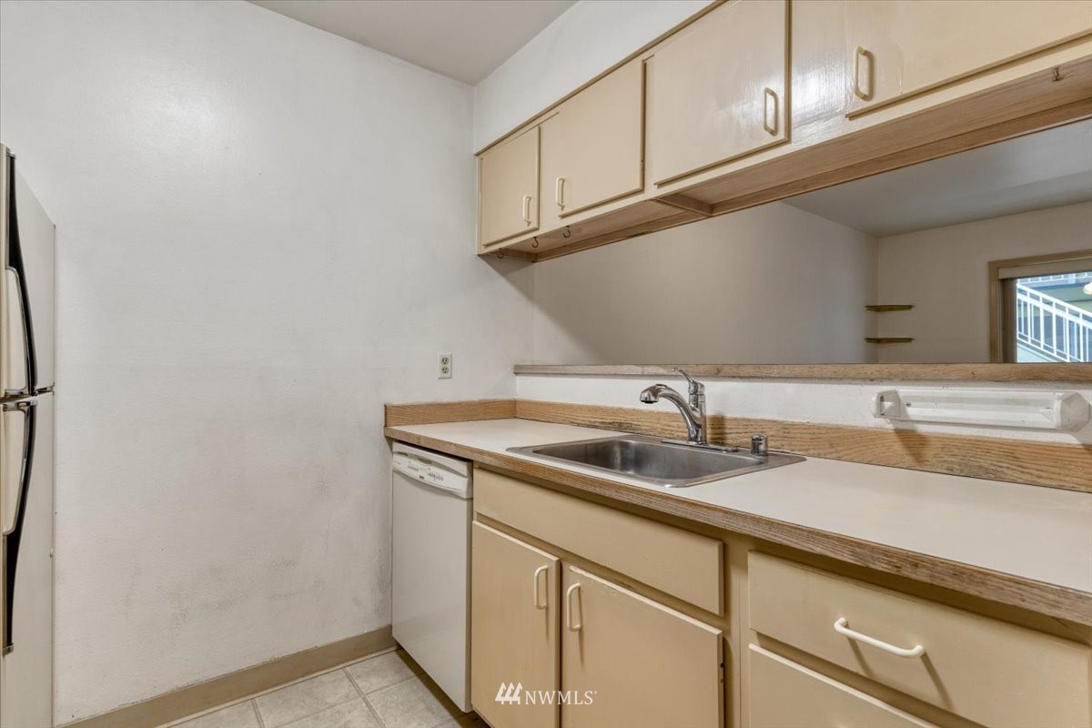 506 East Howell Street, Unit 108 Seattle, WA 98122 - Photo 5 of 20 a kitchen with a sink and cabinets