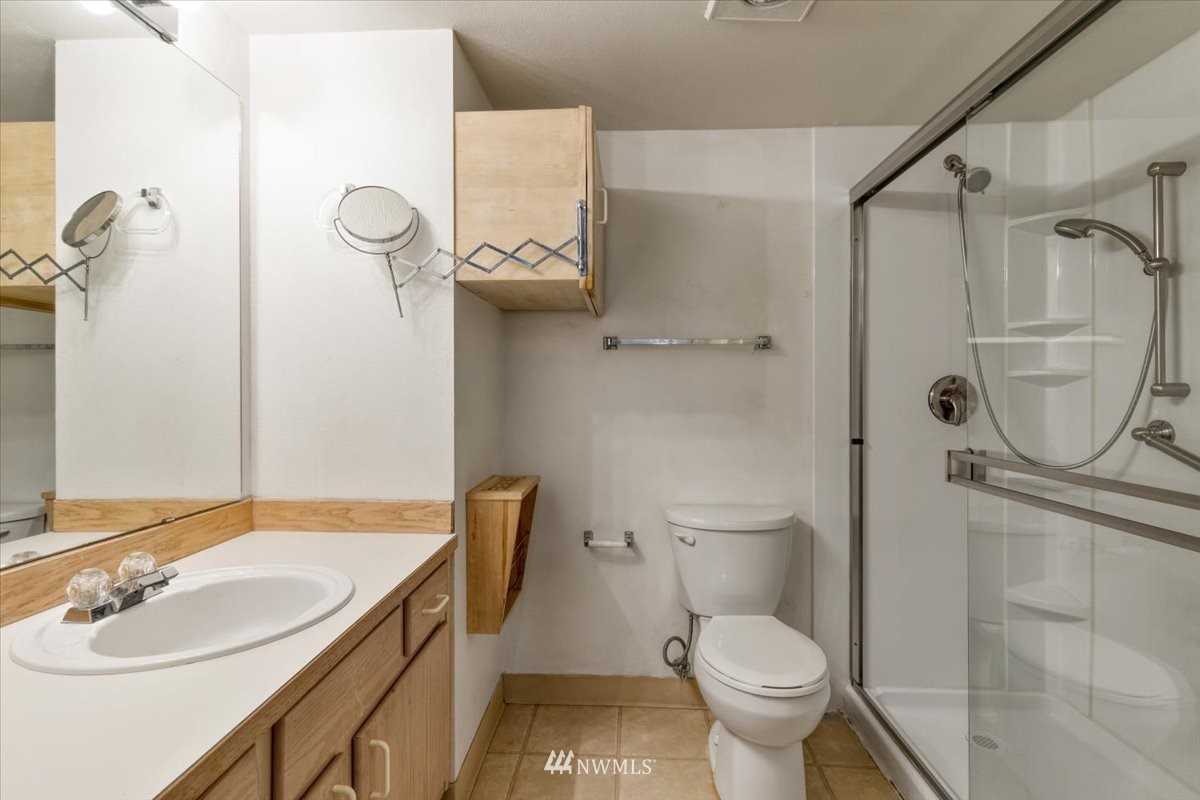 506 East Howell Street, Unit 108 Seattle, WA 98122 - Photo 8 of 20 a bathroom with a sink toilet and shower