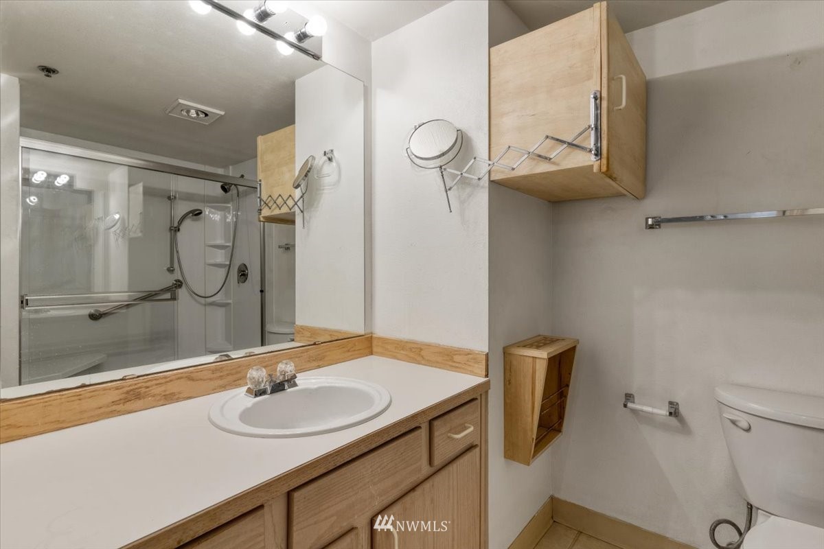 506 East Howell Street, Unit 108 Seattle, WA 98122 - Photo 9 of 20 a bathroom with a sink toilet and shower