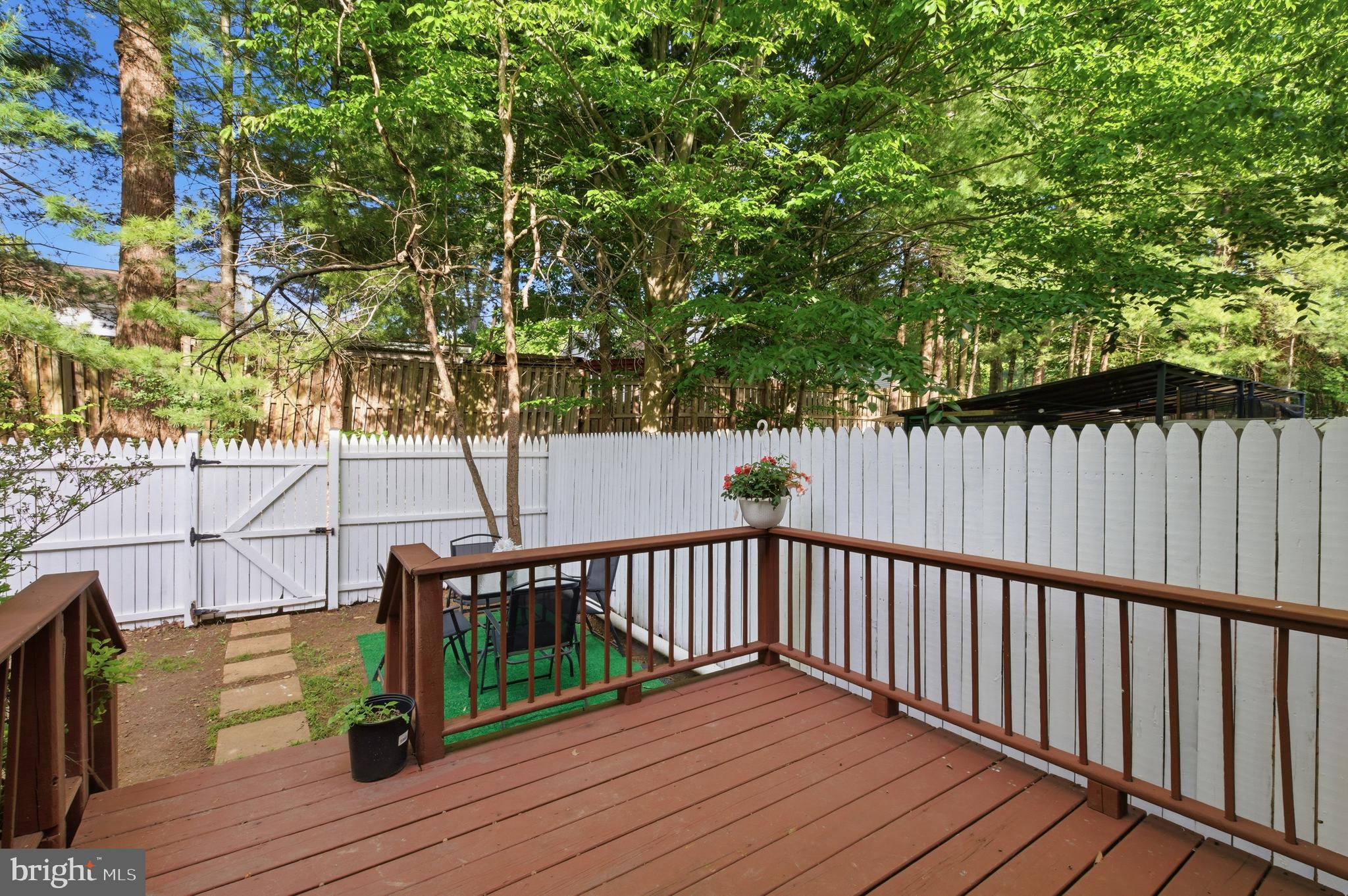 8575 Tyrolean Way Springfield, VA 22153 - Photo 27 of 29 a view of deck with wooden floor and outdoor seating