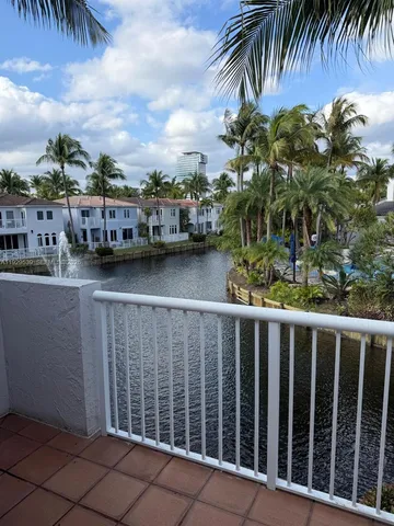 a view of a lake with a house swimming pool and outdoor space