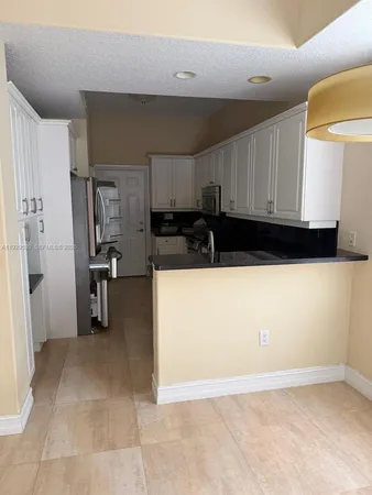 a view of a kitchen with a sink