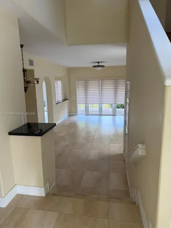 a view of a kitchen with a sink and a window