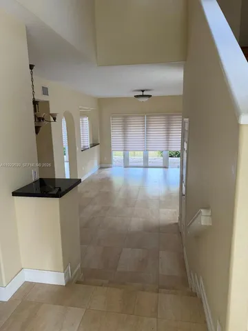 a view of a kitchen with a sink and a window